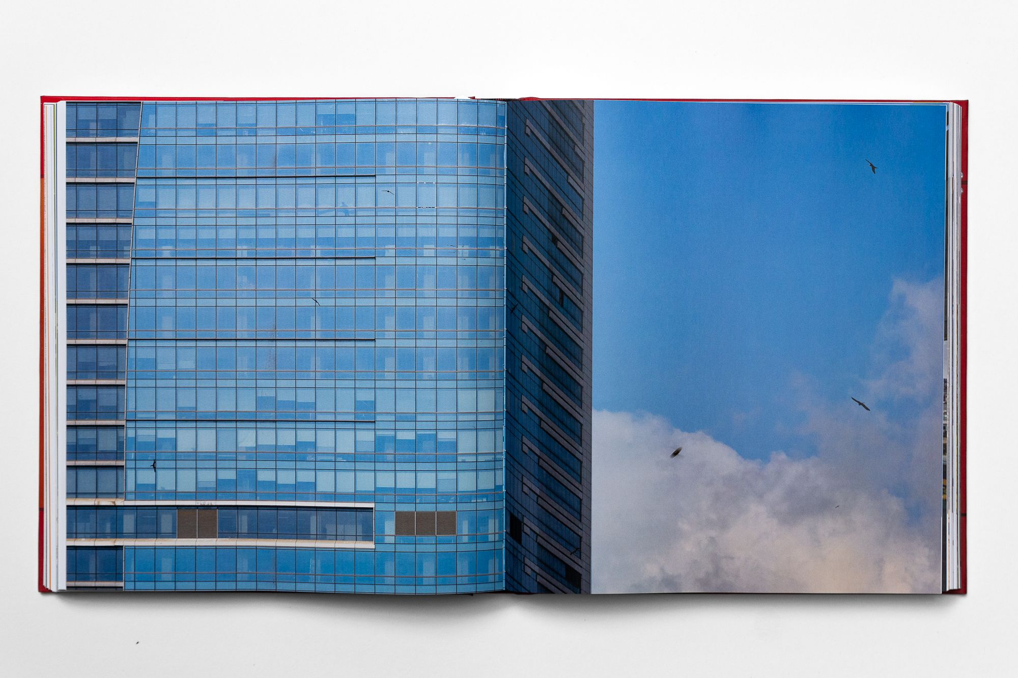 A project spread, a glass tower full bleed across the gutter.