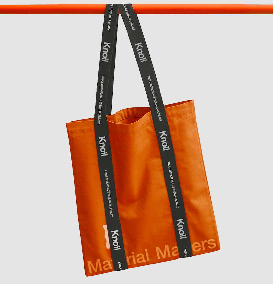 A canvas tote carrying the wordmark.
