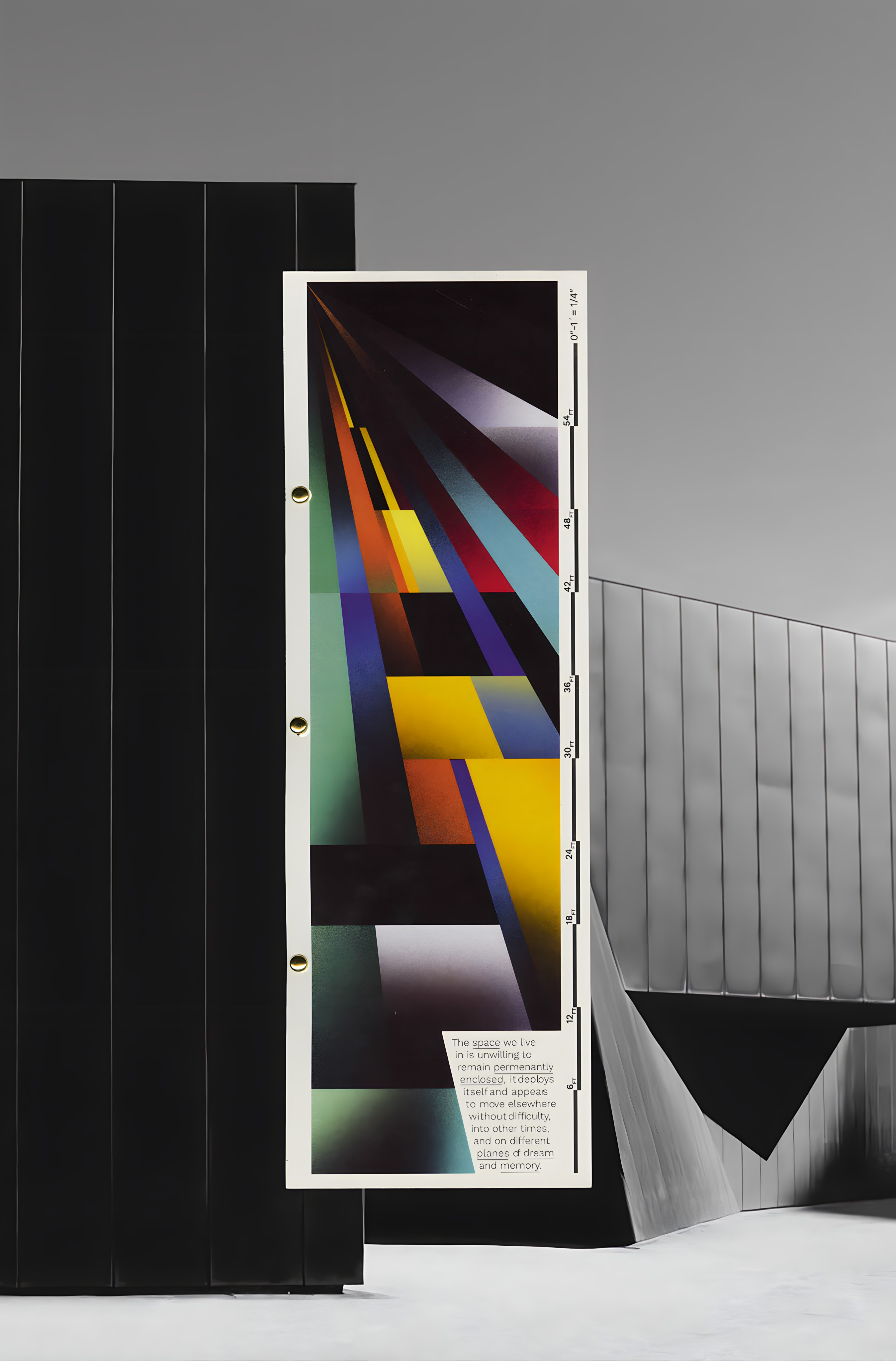 A tall printed poster from Thresholds, propped between two black architectural volumes.